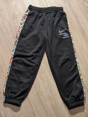 Nike Black Kids Joggers with Multicolor Pixel Side Stripes